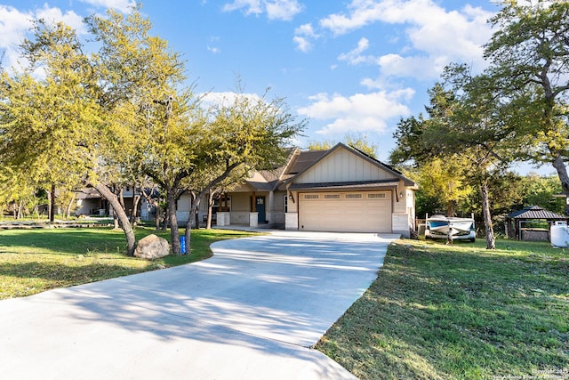 1345 Birch Ln, Fischer, TX 78623 - view of front of property with an attached garage, driveway, a front lawn, a gazebo, and board and batten siding