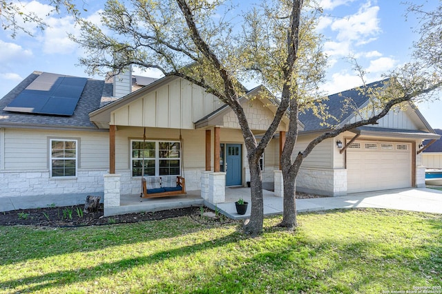 1345 Birch Ln, Fischer, TX 78623 - view of front of home with covered porch, board and batten siding, roof with shingles, and stone siding