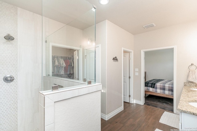 1345 Birch Ln, Fischer, TX 78623 - full bath featuring a walk in shower, wood finished floors, vanity, and baseboards