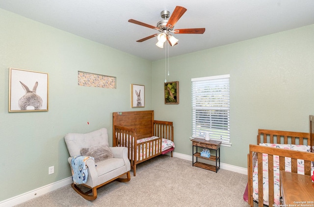 1345 Birch Ln, Fischer, TX 78623 - bedroom with baseboards, light carpet, and a ceiling fan