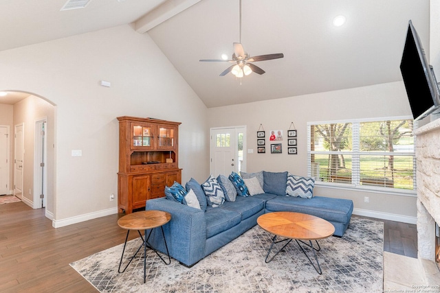 1345 Birch Ln, Fischer, TX 78623 - living area featuring arched walkways, high vaulted ceiling, a ceiling fan, baseboards, and wood finished floors
