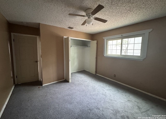 6614 Shady Lk, San Antonio, TX 78244 - unfurnished bedroom featuring a closet, carpet, a textured ceiling, and baseboards