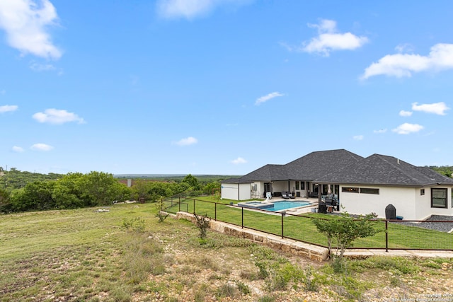 397 County Road 367, Hondo, TX 78861 - rear view of property featuring a patio area, stucco siding, and a garage