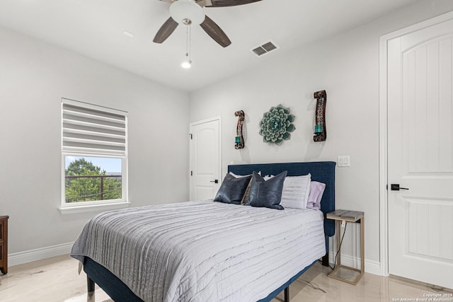 397 County Road 367, Hondo, TX 78861 - bedroom featuring light marble finish floors, baseboards, and ceiling fan