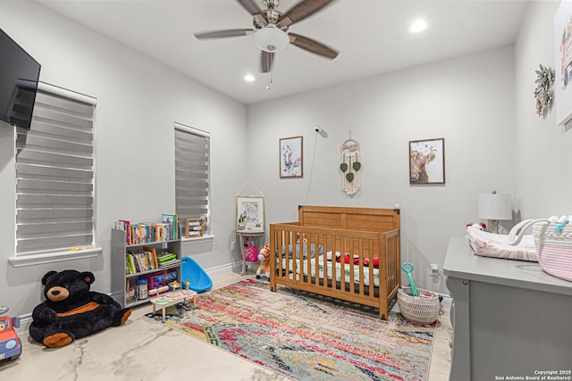 397 County Road 367, Hondo, TX 78861 - bedroom with recessed lighting, a nursery area, a ceiling fan, and baseboards