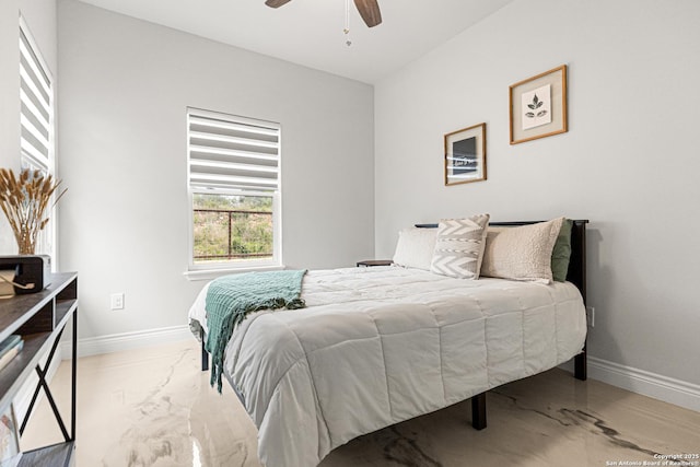 397 County Road 367, Hondo, TX 78861 - bedroom with baseboards, light marble finish floors, and a ceiling fan