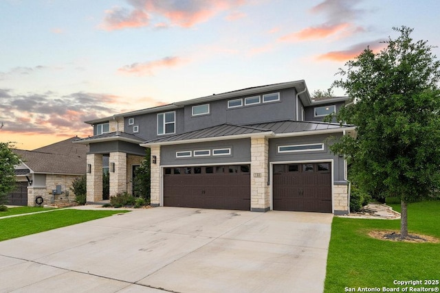 150 Cool Rock, Boerne, TX 78006 - prairie-style home with stone siding, concrete driveway, a standing seam roof, and a front yard