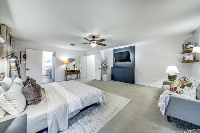 bedroom with light carpet, ceiling fan, and baseboards