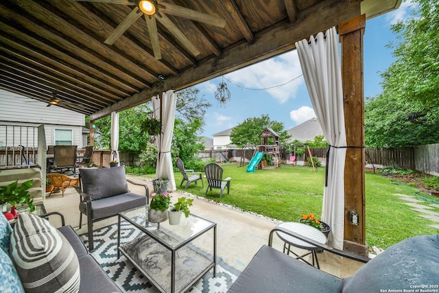 view of patio / terrace with ceiling fan, a playground, an outdoor living space, and outdoor dining area