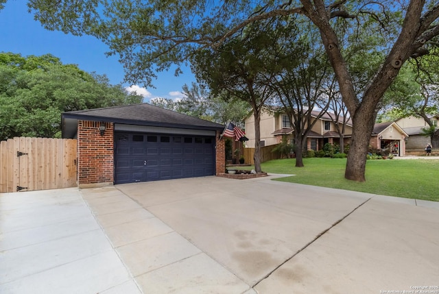 view of front of property featuring brick siding, a garage, a shingled roof, and a gate