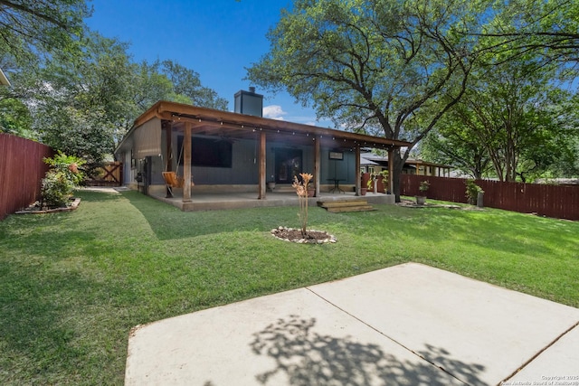 back of house featuring a patio and a chimney