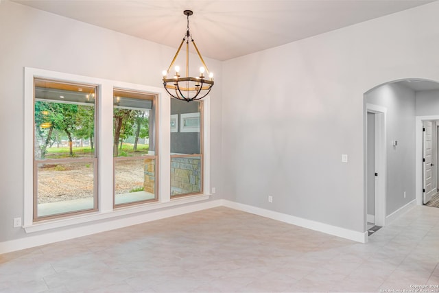 LOT52 Hondo Vis, La Vernia, TX 78121 - unfurnished room featuring arched walkways, a chandelier, and baseboards