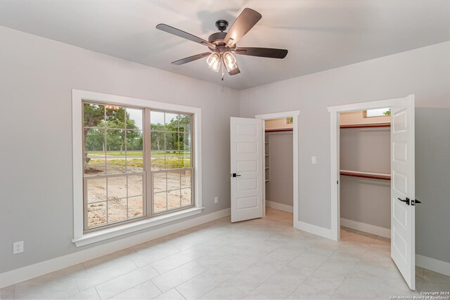 LOT52 Hondo Vis, La Vernia, TX 78121 - unfurnished bedroom featuring baseboards and a ceiling fan