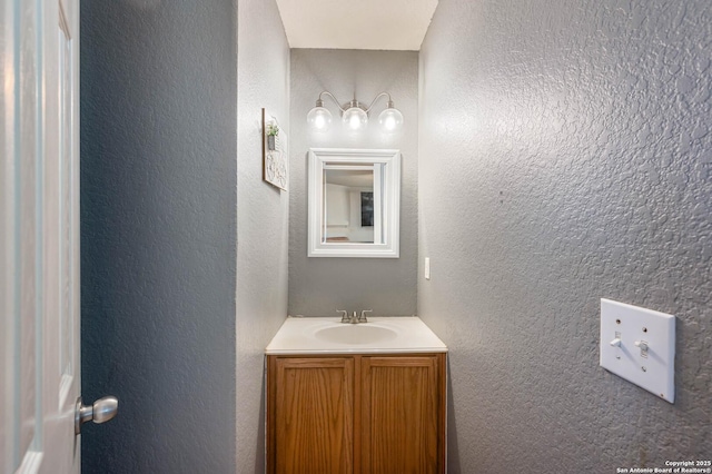 3911 Valencia Peak, San Antonio, TX 78261 - bathroom with a textured wall and vanity