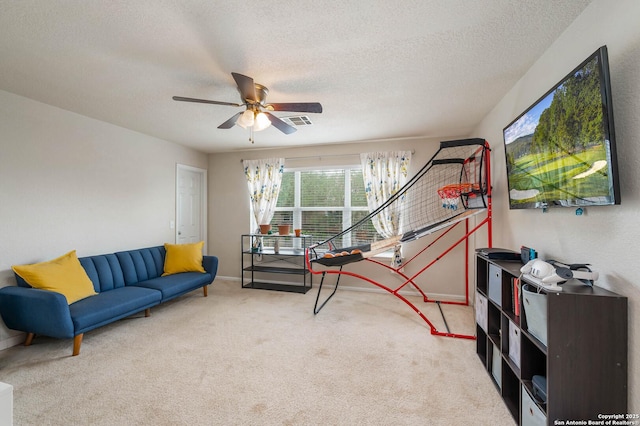 3911 Valencia Peak, San Antonio, TX 78261 - carpeted living area featuring a ceiling fan, a textured ceiling, and baseboards