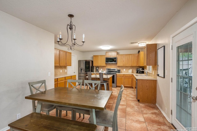 3911 Valencia Peak, San Antonio, TX 78261 - dining space with a chandelier and baseboards