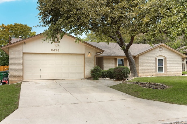 5423 Princess Diane, San Antonio, TX 78229 - single story home with a front lawn, a garage, driveway, and brick siding