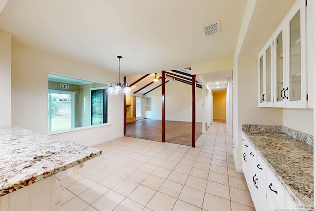 5423 Princess Diane, San Antonio, TX 78229 - unfurnished dining area with light tile patterned floors, baseboards, and a chandelier