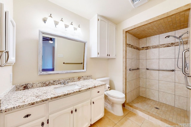 5423 Princess Diane, San Antonio, TX 78229 - full bathroom featuring toilet, tiled shower, vanity, and tile patterned floors