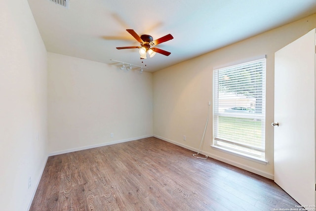 5423 Princess Diane, San Antonio, TX 78229 - empty room with wood finished floors, ceiling fan, and baseboards
