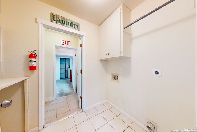 5423 Princess Diane, San Antonio, TX 78229 - laundry room featuring hookup for a washing machine, hookup for an electric dryer, light tile patterned floors, cabinet space, and baseboards