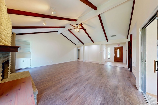 5423 Princess Diane, San Antonio, TX 78229 - unfurnished living room with a ceiling fan, a stone fireplace, wood finished floors, and baseboards