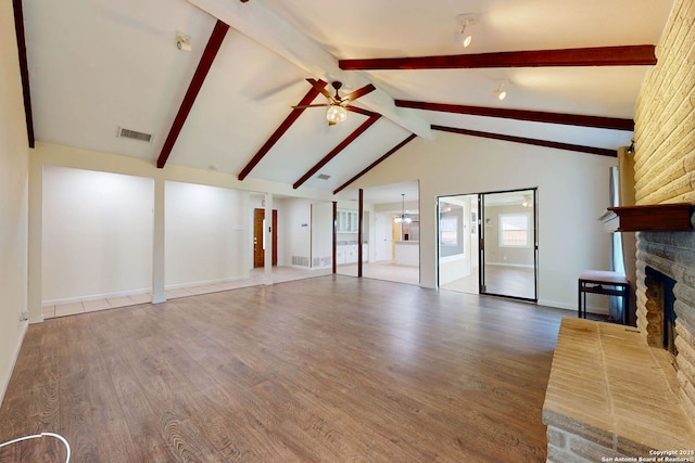 5423 Princess Diane, San Antonio, TX 78229 - unfurnished living room featuring a fireplace, ceiling fan, wood finished floors, and baseboards