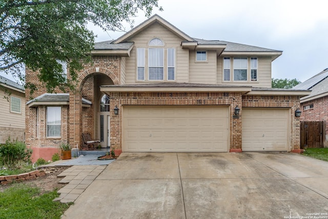22319 Chimayo, San Antonio, TX 78258 - traditional-style house with brick siding, a garage, and concrete driveway
