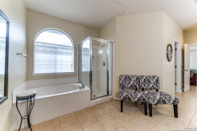 22319 Chimayo, San Antonio, TX 78258 - bathroom featuring tile patterned floors, a shower stall, a bath, and ensuite bath