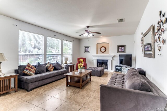 22319 Chimayo, San Antonio, TX 78258 - living room with a ceiling fan, light tile patterned flooring, and a fireplace with raised hearth