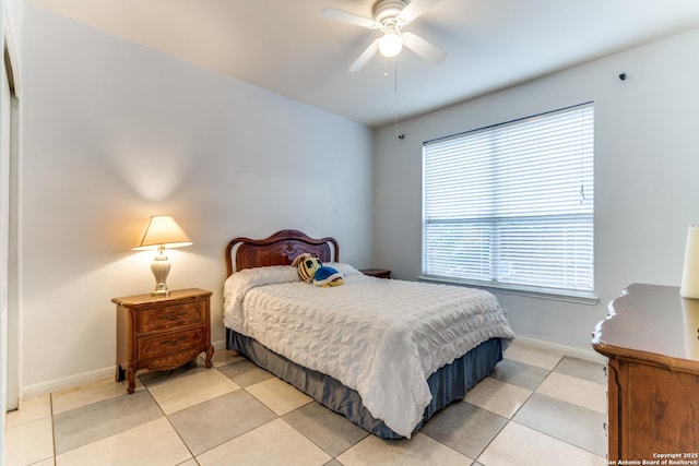 22319 Chimayo, San Antonio, TX 78258 - bedroom featuring baseboards, light tile patterned floors, and a ceiling fan