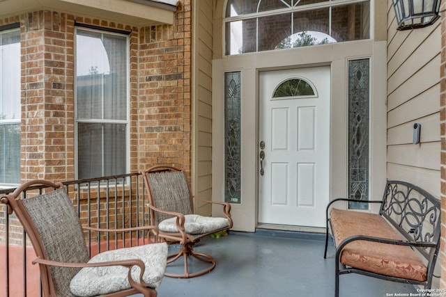 22319 Chimayo, San Antonio, TX 78258 - doorway to property featuring brick siding and a porch