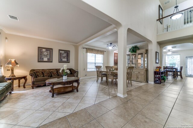 22319 Chimayo, San Antonio, TX 78258 - living area featuring ceiling fan, crown molding, light tile patterned floors, and baseboards