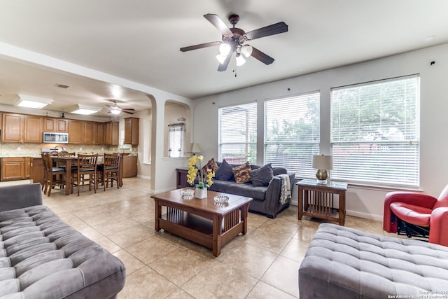 22319 Chimayo, San Antonio, TX 78258 - living area featuring ceiling fan, light tile patterned flooring, and baseboards