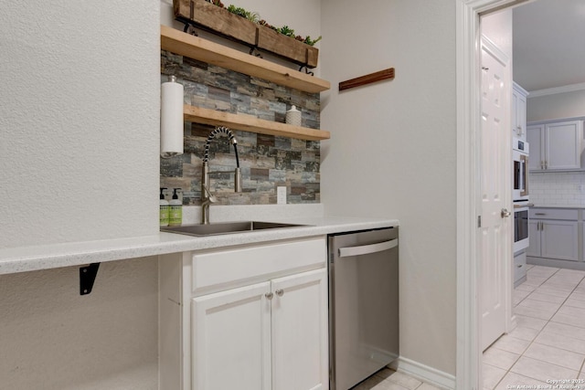 27 Sherborne Wood, San Antonio, TX 78218 - bar area with stainless steel dishwasher, a sink, decorative backsplash, light tile patterned floors, and double oven