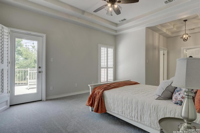 27 Sherborne Wood, San Antonio, TX 78218 - bedroom featuring a raised ceiling, access to outside, multiple windows, and carpet floors
