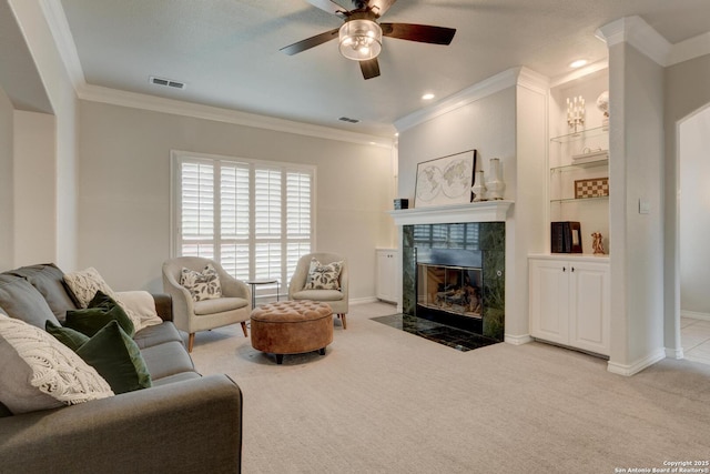 27 Sherborne Wood, San Antonio, TX 78218 - living room with a tile fireplace, ornamental molding, a ceiling fan, carpet floors, and baseboards