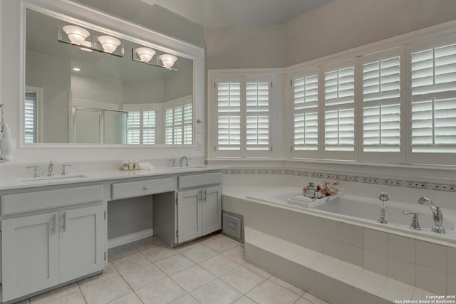 27 Sherborne Wood, San Antonio, TX 78218 - bathroom with a bath, tile patterned flooring, double vanity, and a stall shower