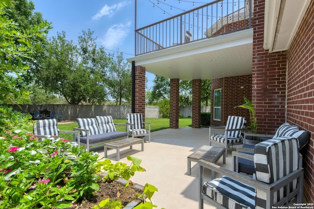 27 Sherborne Wood, San Antonio, TX 78218 - fenced backyard with outdoor lounge area, a patio, and a balcony