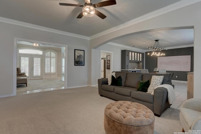 27 Sherborne Wood, San Antonio, TX 78218 - living room with a chandelier, ornamental molding, baseboards, light carpet, and arched walkways