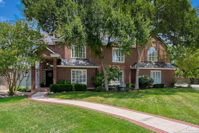 27 Sherborne Wood, San Antonio, TX 78218 - view of front of house with brick siding and a front lawn