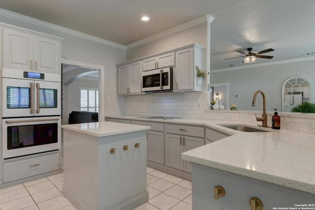 27 Sherborne Wood, San Antonio, TX 78218 - kitchen with white appliances, a sink, light tile patterned floors, backsplash, and ornamental molding