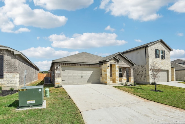 11515 Cottage Pt, San Antonio, TX 78254 - view of front facade with concrete driveway, stone siding, cooling unit, brick siding, and an attached garage