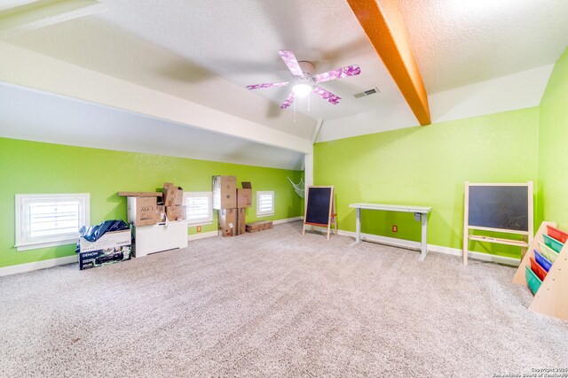 714 Ruidosa Downs, Helotes, TX 78023 - recreation room with lofted ceiling, carpet flooring, a textured ceiling, a ceiling fan, and baseboards