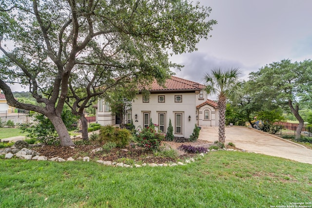 714 Ruidosa Downs, Helotes, TX 78023 - mediterranean / spanish home featuring stucco siding, a tiled roof, and concrete driveway