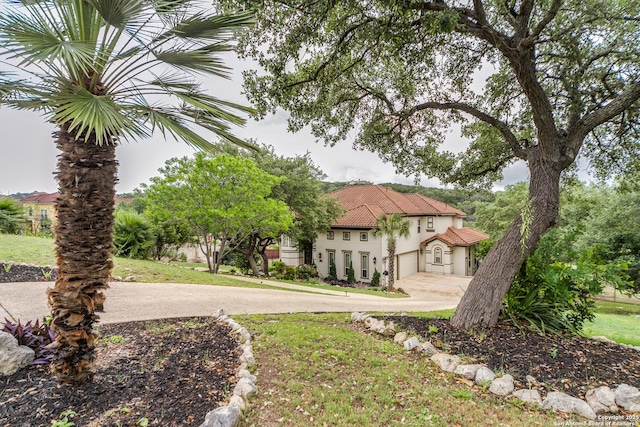 714 Ruidosa Downs, Helotes, TX 78023 - view of green lawn featuring driveway and a garage