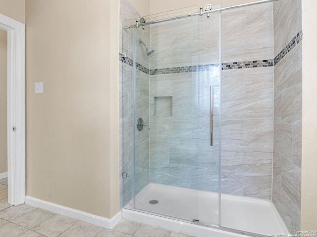 928 W Huisache, San Antonio, TX 78201 - full bathroom featuring a shower stall, tile patterned floors, and baseboards