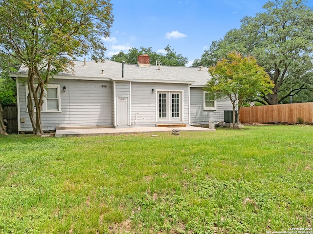 928 W Huisache, San Antonio, TX 78201 - rear view of property with french doors, a patio area, and a chimney