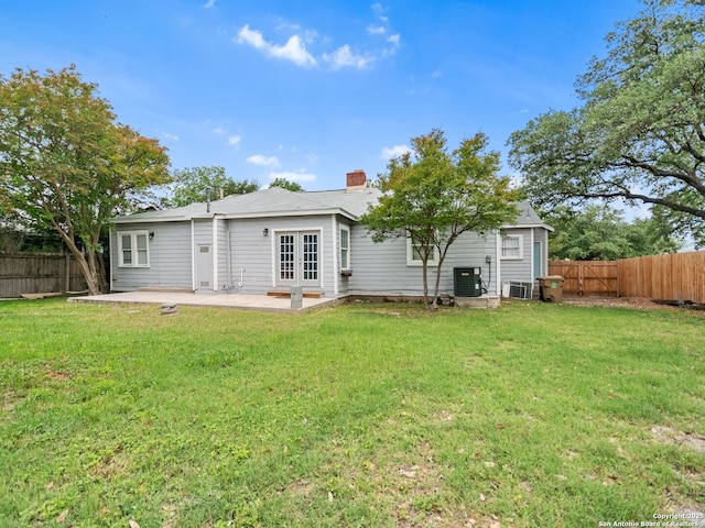 928 W Huisache, San Antonio, TX 78201 - back of property featuring french doors, a patio, cooling unit, and a chimney