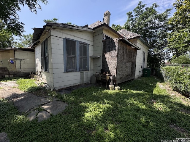 104 E Harlan, San Antonio, TX 78214 - view of side of home with a chimney